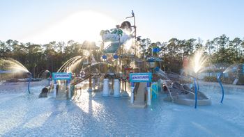 Splash pad with pirate ship theme and water features